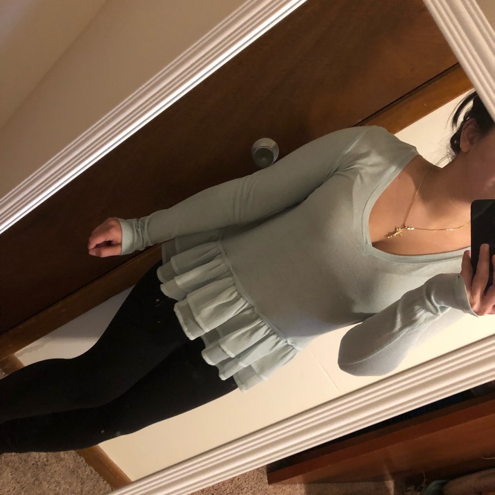 Light blue v-neck long sleeve shirt with peplum